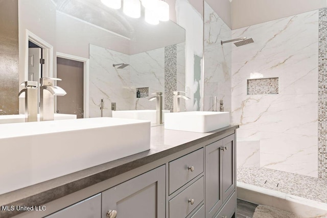 8992 Gavin Dr, Olive Branch, MS 38654 - bathroom with double vanity and a marble finish shower