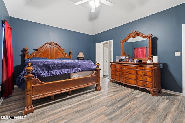 8992 Gavin Dr, Olive Branch, MS 38654 - bedroom with wood finished floors, lofted ceiling, ceiling fan, and baseboards