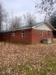 5685 Carrollton Rd, Grenada, MS 38901 - back of house featuring central air condition unit
