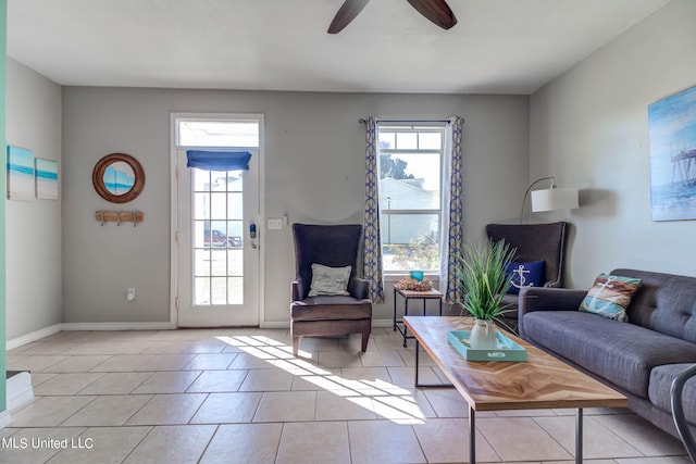 living room with ceiling fan and light tile patterned floors