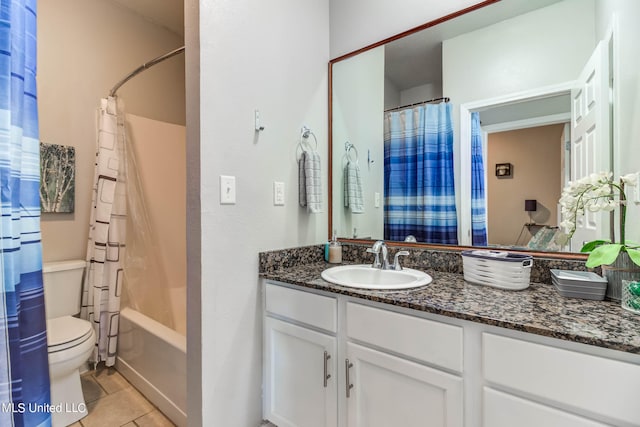 full bathroom featuring vanity, toilet, shower / bath combo with shower curtain, and tile patterned flooring