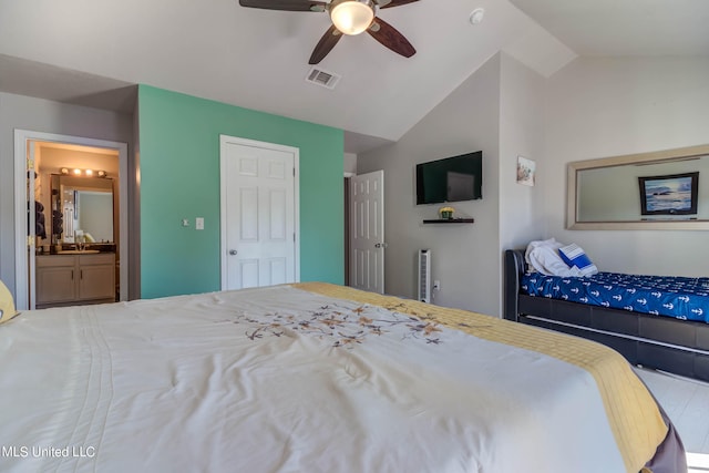 bedroom featuring connected bathroom, ceiling fan, and vaulted ceiling