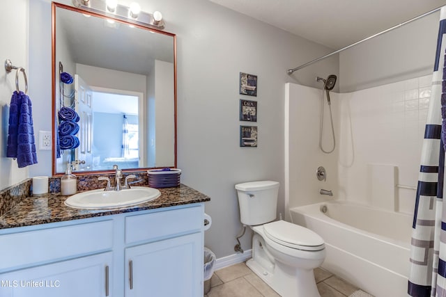 full bathroom featuring toilet, shower / bath combo, vanity, and tile patterned floors