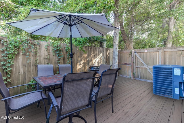 wooden deck featuring central air condition unit