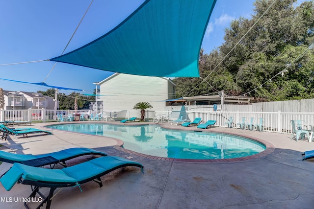 view of swimming pool featuring a patio area