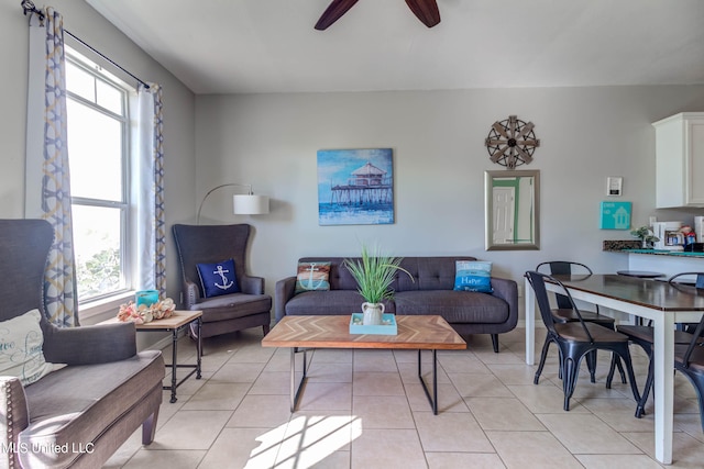 tiled living room featuring ceiling fan