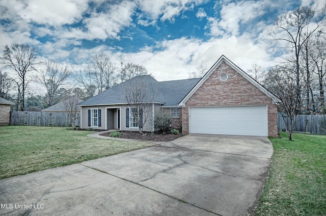 view of front of home featuring a front lawn and a garage