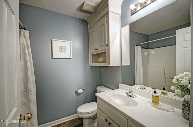 bathroom with wood-type flooring, a textured ceiling, toilet, vanity, and a shower with shower curtain