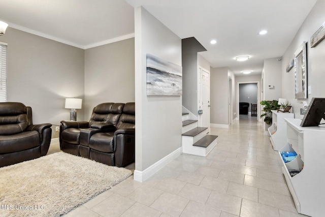 living room featuring washer / dryer, light tile patterned flooring, and ornamental molding