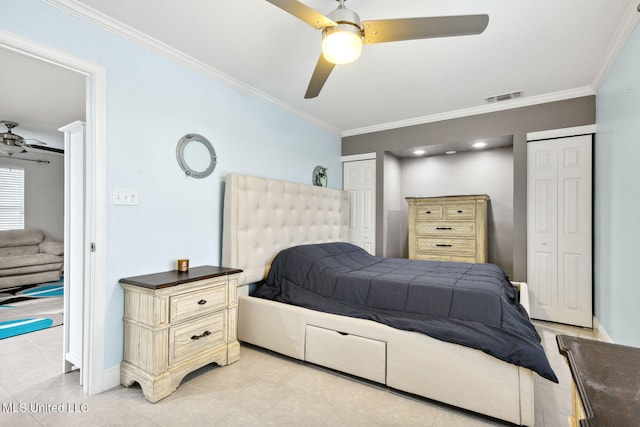 tiled bedroom with multiple closets, ceiling fan, and crown molding