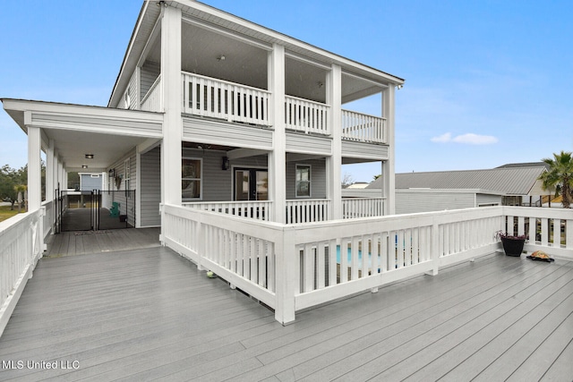 wooden deck featuring a pool