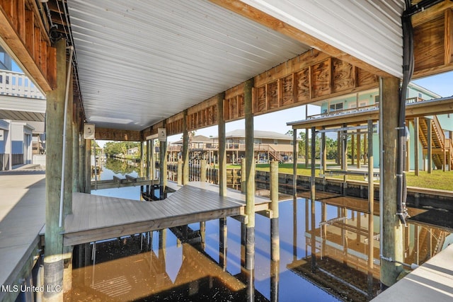 dock area featuring a water view