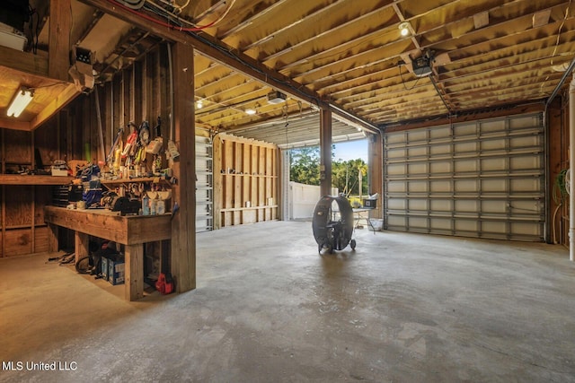 garage featuring a workshop area and a garage door opener