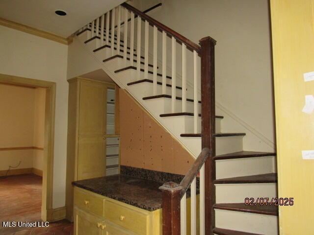 staircase with ornamental molding