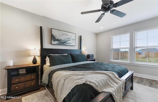 14451 Quail Ridge Dr, Gulfport, MS 39503 - bedroom featuring wood finished floors, baseboards, and ceiling fan