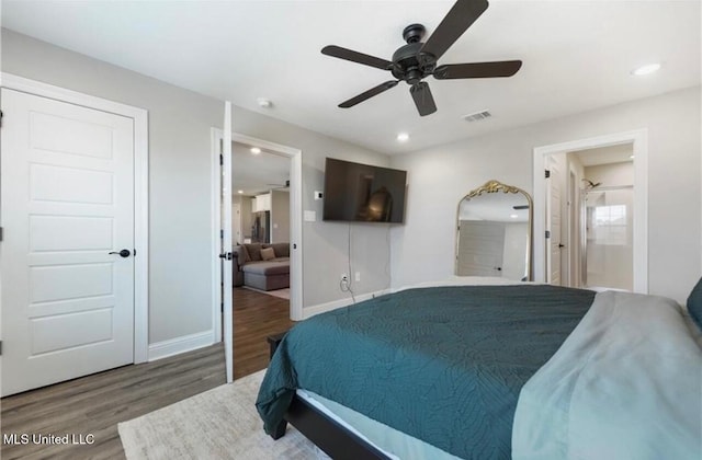 14451 Quail Ridge Dr, Gulfport, MS 39503 - bedroom with wood finished floors, recessed lighting, baseboards, connected bathroom, and ceiling fan
