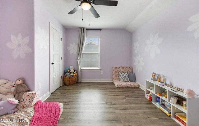 14451 Quail Ridge Dr, Gulfport, MS 39503 - living area with wood finished floors, ceiling fan, baseboards, and vaulted ceiling