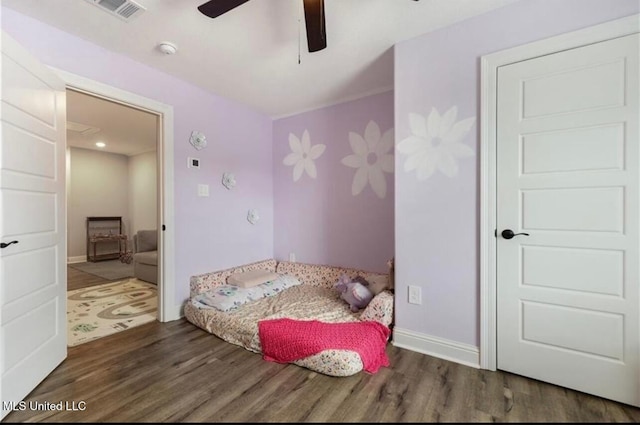 14451 Quail Ridge Dr, Gulfport, MS 39503 - bedroom with wood finished floors, a ceiling fan, and baseboards