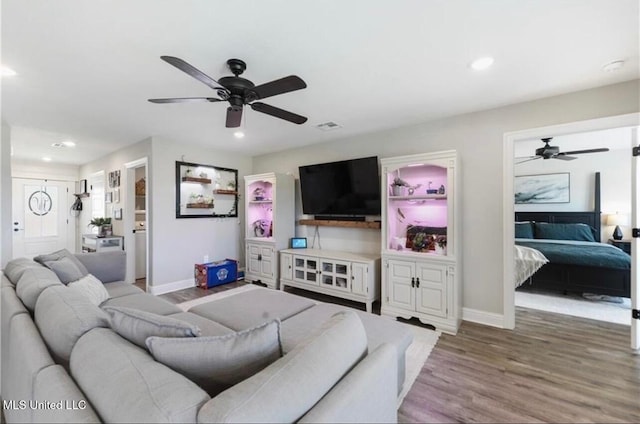 14451 Quail Ridge Dr, Gulfport, MS 39503 - living area with ceiling fan, wood finished floors, recessed lighting, and baseboards