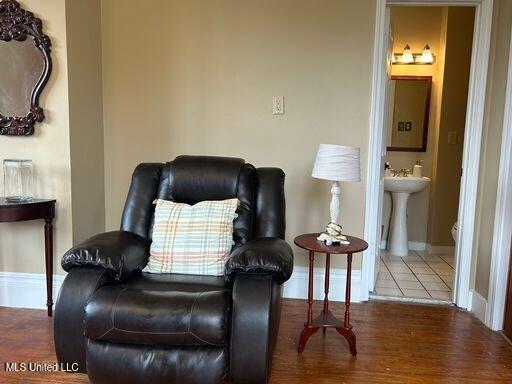1116 Main St, Natchez, MS 39120 - living area featuring wood finished floors and baseboards
