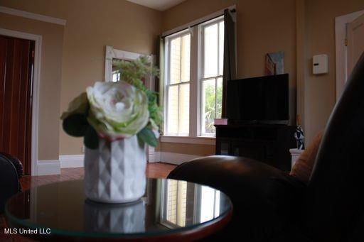 1116 Main St, Natchez, MS 39120 - dining room featuring a healthy amount of sunlight and baseboards