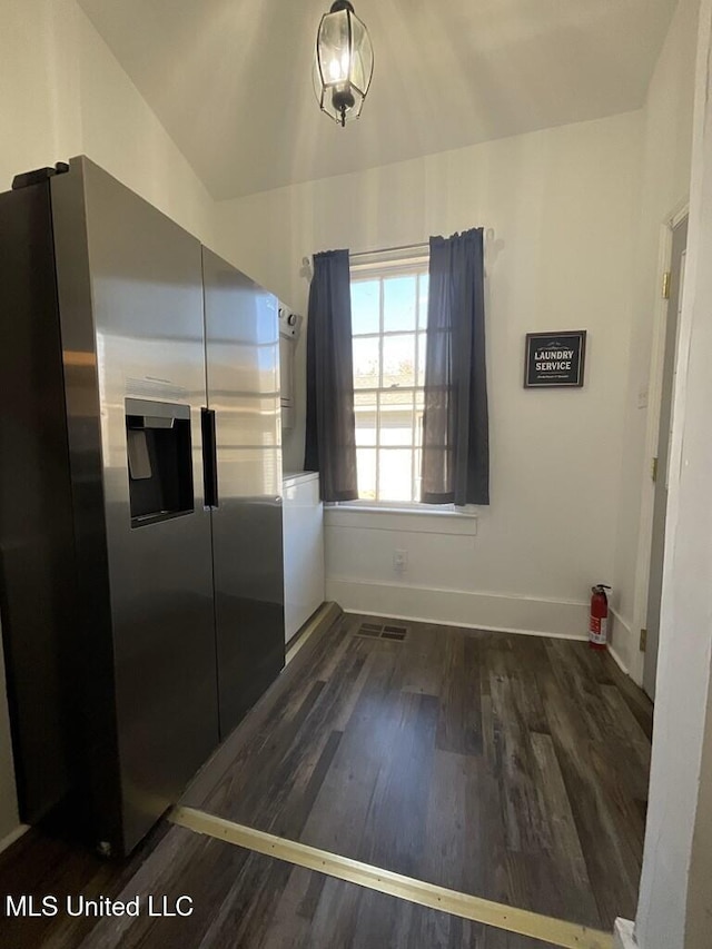 1116 Main St, Natchez, MS 39120 - unfurnished dining area featuring visible vents, wood finished floors, and baseboards
