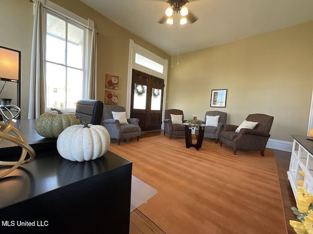 1116 Main St, Natchez, MS 39120 - living room with a wealth of natural light, french doors, wood finished floors, and ceiling fan
