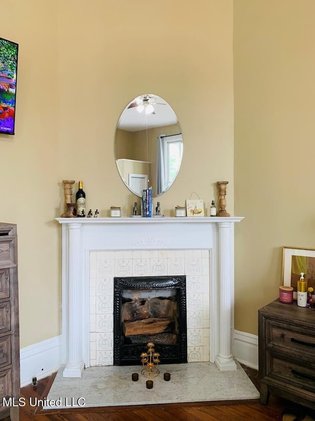 1116 Main St, Natchez, MS 39120 - interior details featuring baseboards, wood finished floors, and a tiled fireplace
