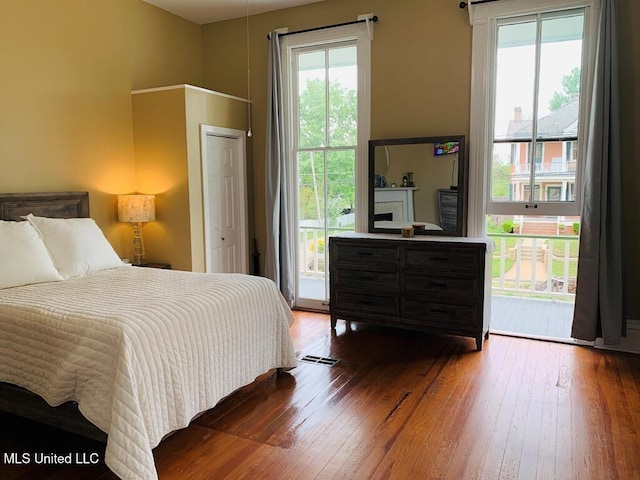 1116 Main St, Natchez, MS 39120 - bedroom with access to exterior and hardwood / wood-style flooring
