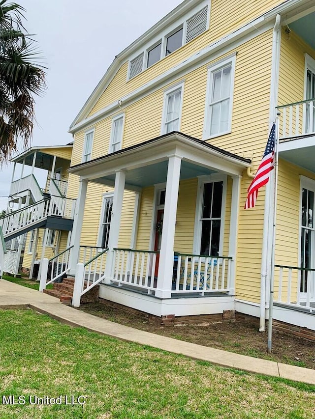 1116 Main St, Natchez, MS 39120 - view of front of property featuring a porch