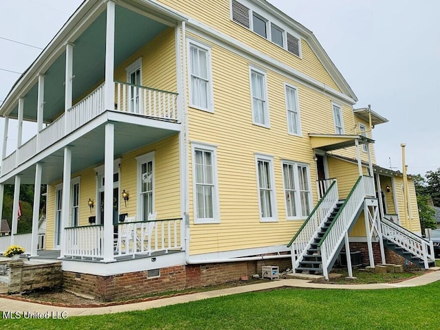 1116 Main St, Natchez, MS 39120 - exterior space featuring stairway, central AC, covered porch, a yard, and crawl space