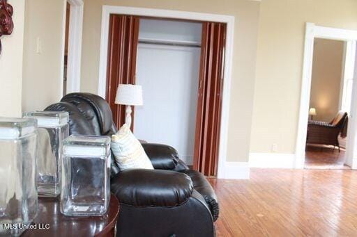 1116 Main St, Natchez, MS 39120 - living area featuring baseboards and wood finished floors