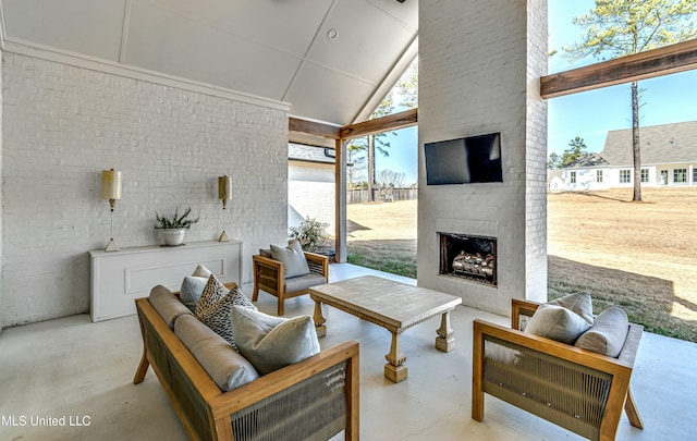 view of patio with an outdoor living space with a fireplace