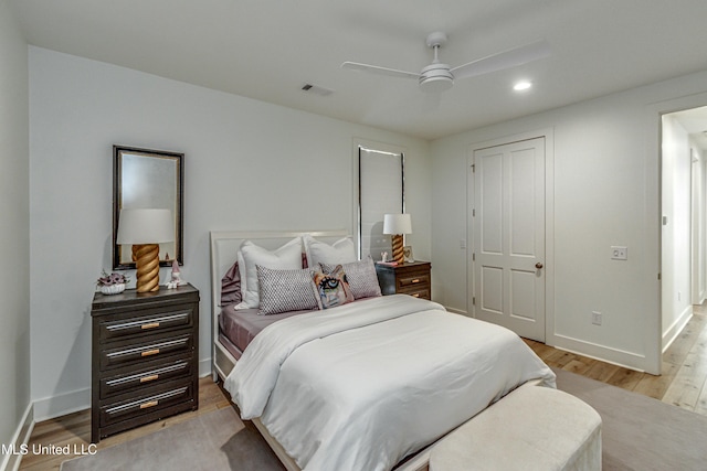 bedroom with ceiling fan, a closet, and light wood-type flooring