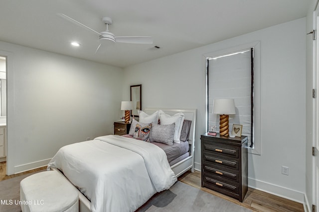 bedroom with ceiling fan and hardwood / wood-style floors