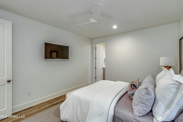 bedroom with ceiling fan and light hardwood / wood-style flooring