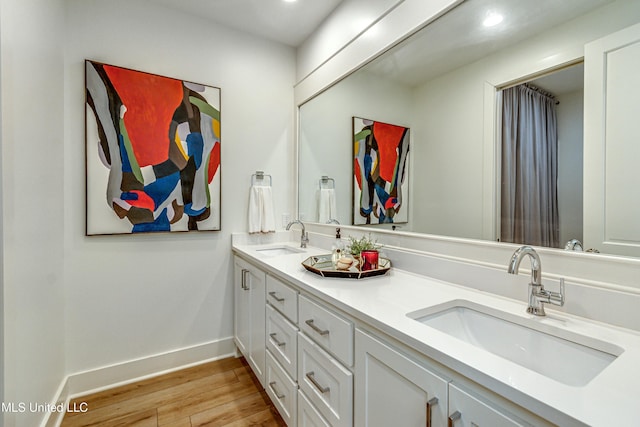 bathroom with vanity and hardwood / wood-style floors