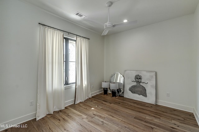 interior space with hardwood / wood-style flooring and ceiling fan