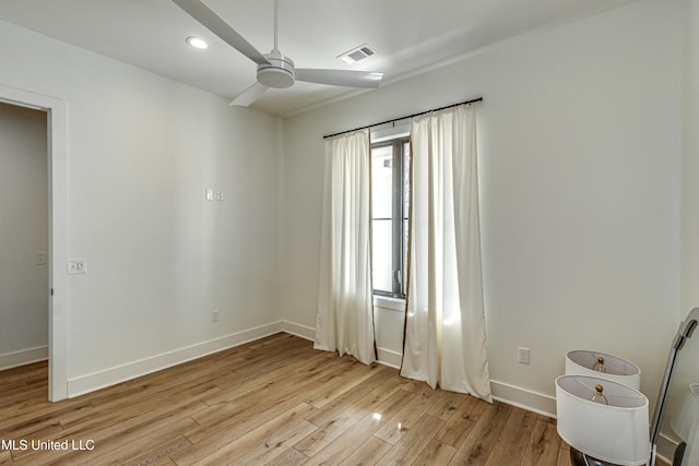 unfurnished room featuring ceiling fan and light hardwood / wood-style floors