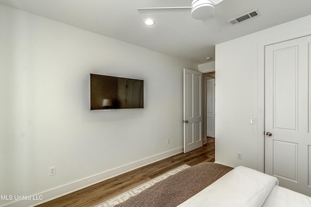 bedroom featuring dark hardwood / wood-style floors and ceiling fan