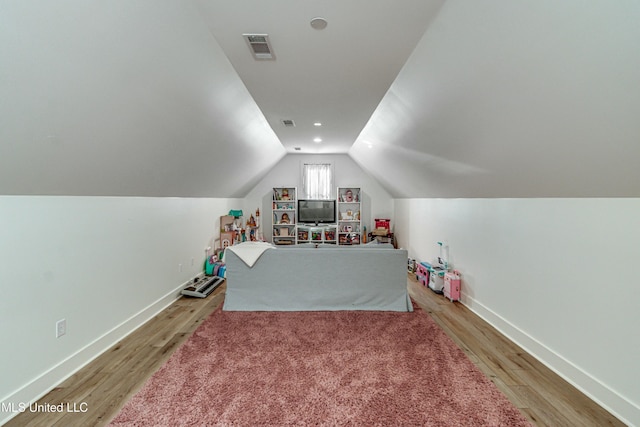 game room with lofted ceiling and light wood-type flooring