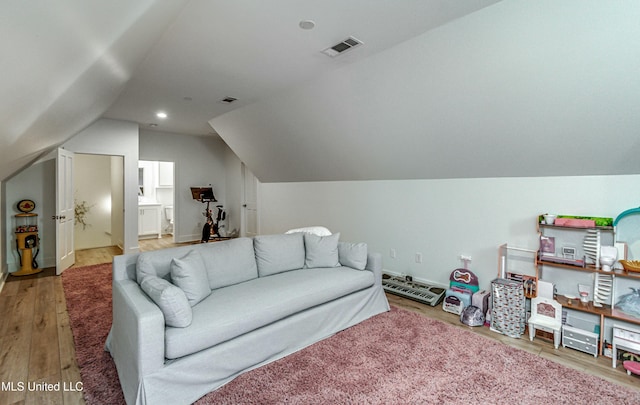 living room with lofted ceiling and wood-type flooring