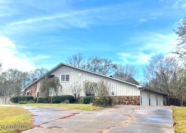 view of side of home with a garage