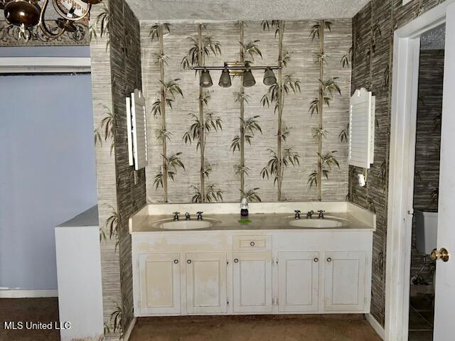 bathroom featuring vanity and a textured ceiling