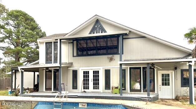 back of house with a patio and ceiling fan