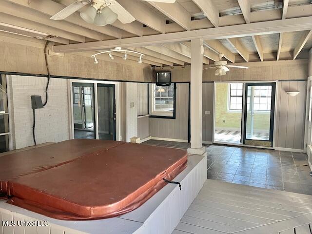 view of patio featuring ceiling fan and a covered hot tub