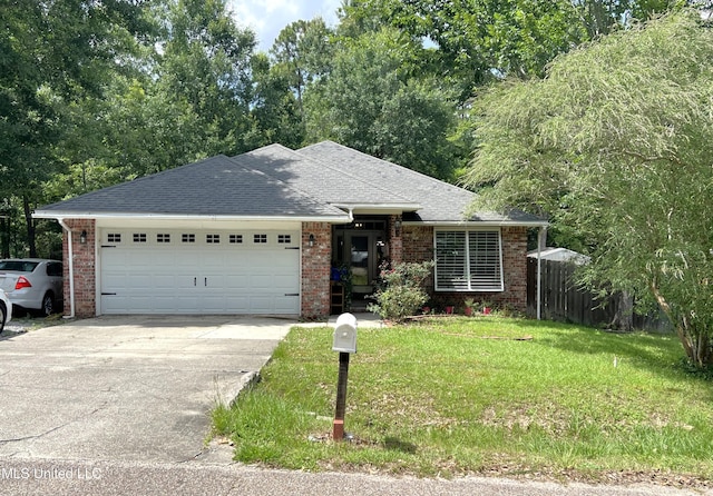 9929 Kahana St, Diamondhead, MS 39525 - ranch-style house with an attached garage, concrete driveway, brick siding, and a shingled roof