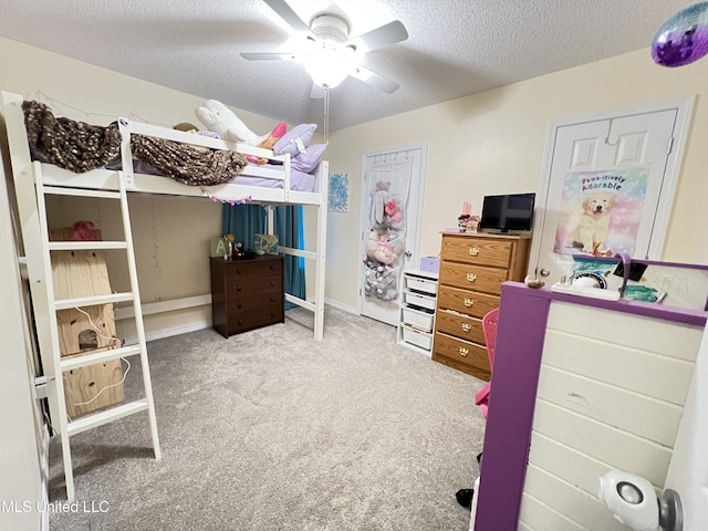 9929 Kahana St, Diamondhead, MS 39525 - carpeted bedroom featuring a textured ceiling and ceiling fan