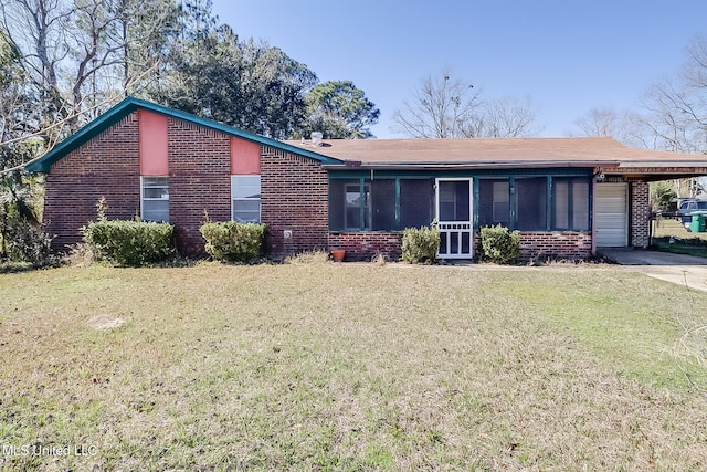 single story home with a front lawn and a carport