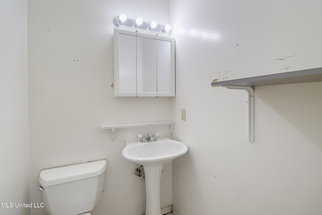 bathroom featuring toilet